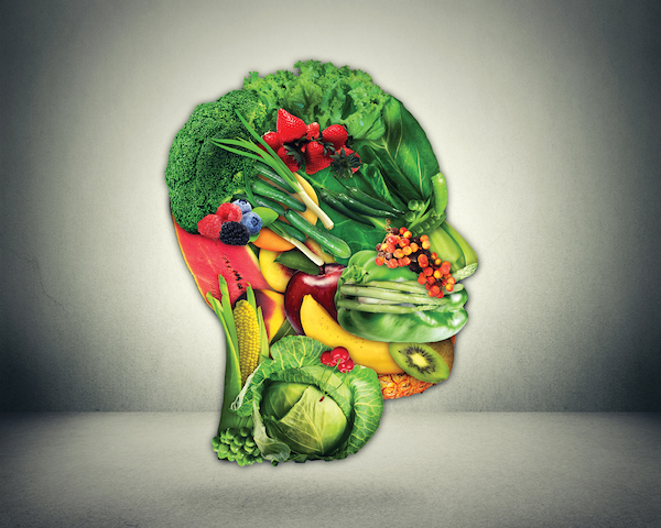 Egy emberi fej formája kirakva gyümölcsökből és zöldségekből.